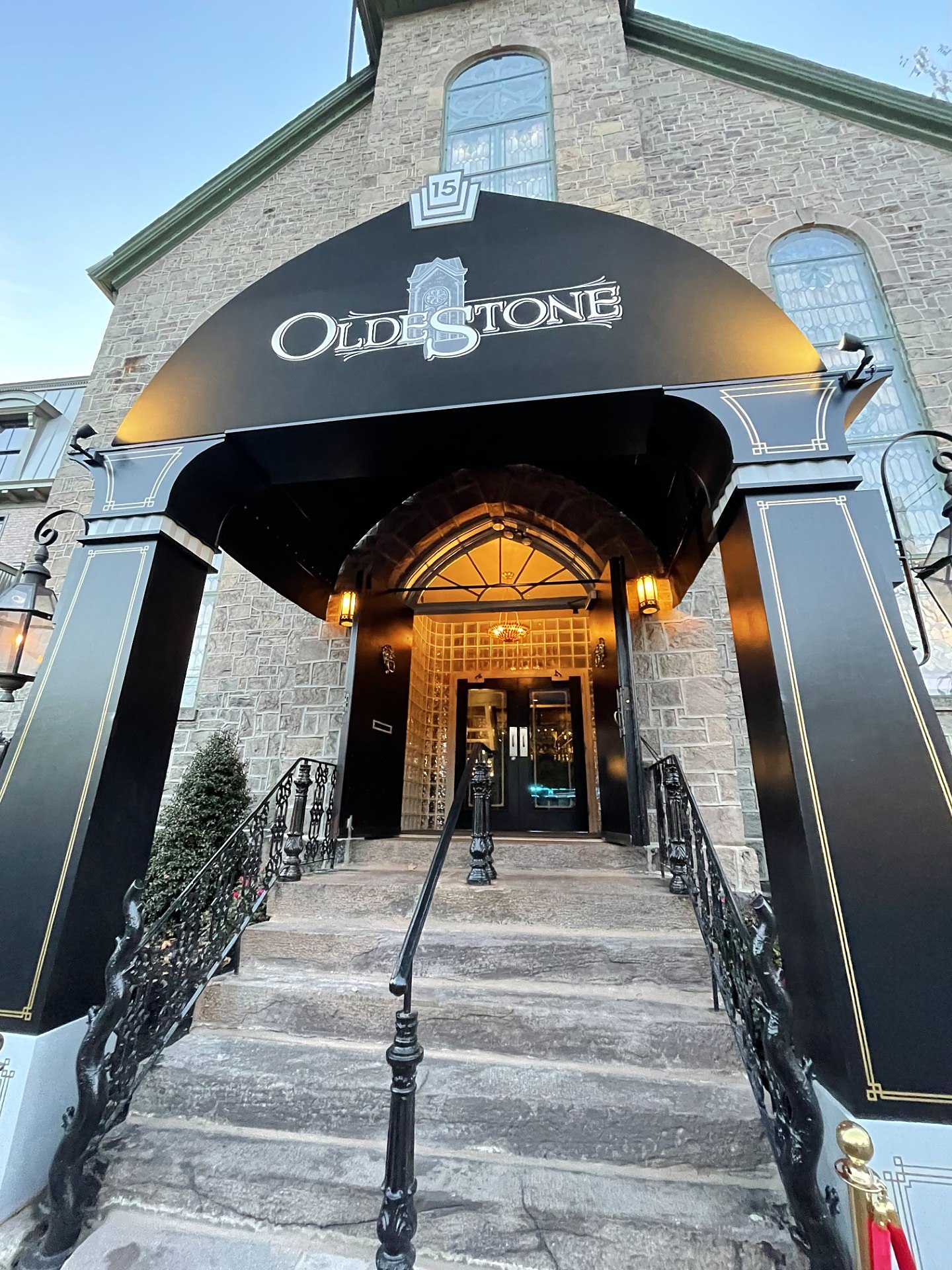 The awning and the stone entrance at dusk