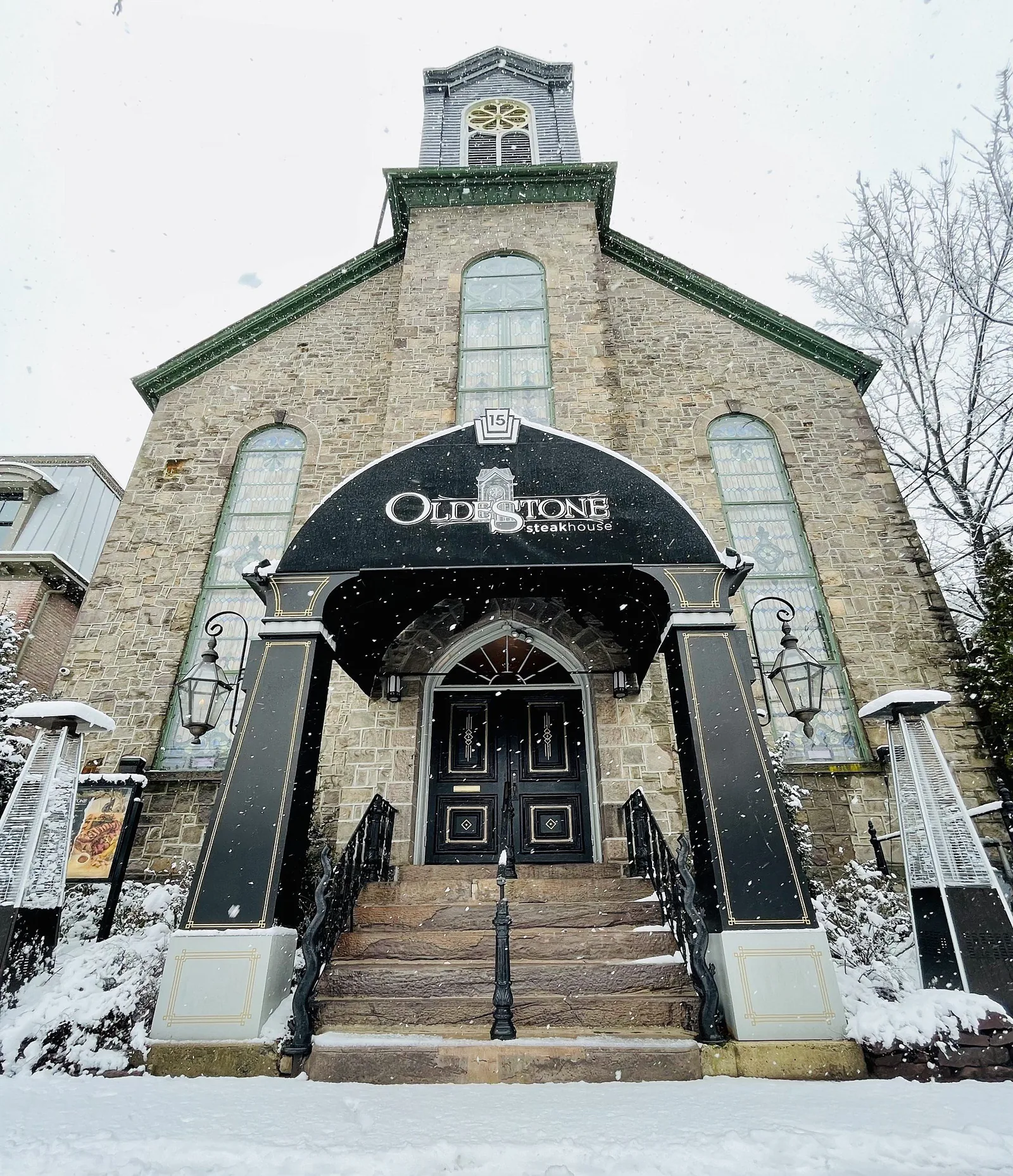 The stone church on South Main Street in the snow
